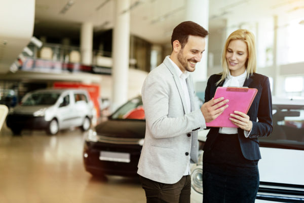 CheckCars24 | Shot of two young businesswomen talking